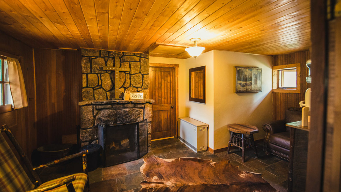 Ponderosa cabin living area with fireplace.
