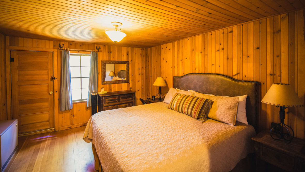 Trailhead cabin master bedroom with king size bed.