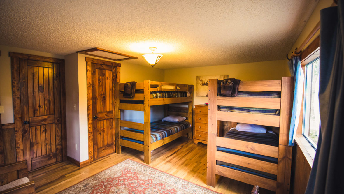 Cottonwood cabin kids' bedroom with two sets of bunkbeds.