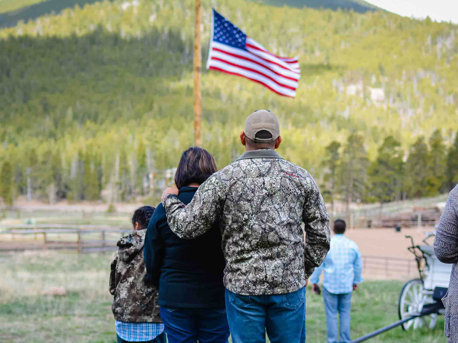 Family starring at the American flag.