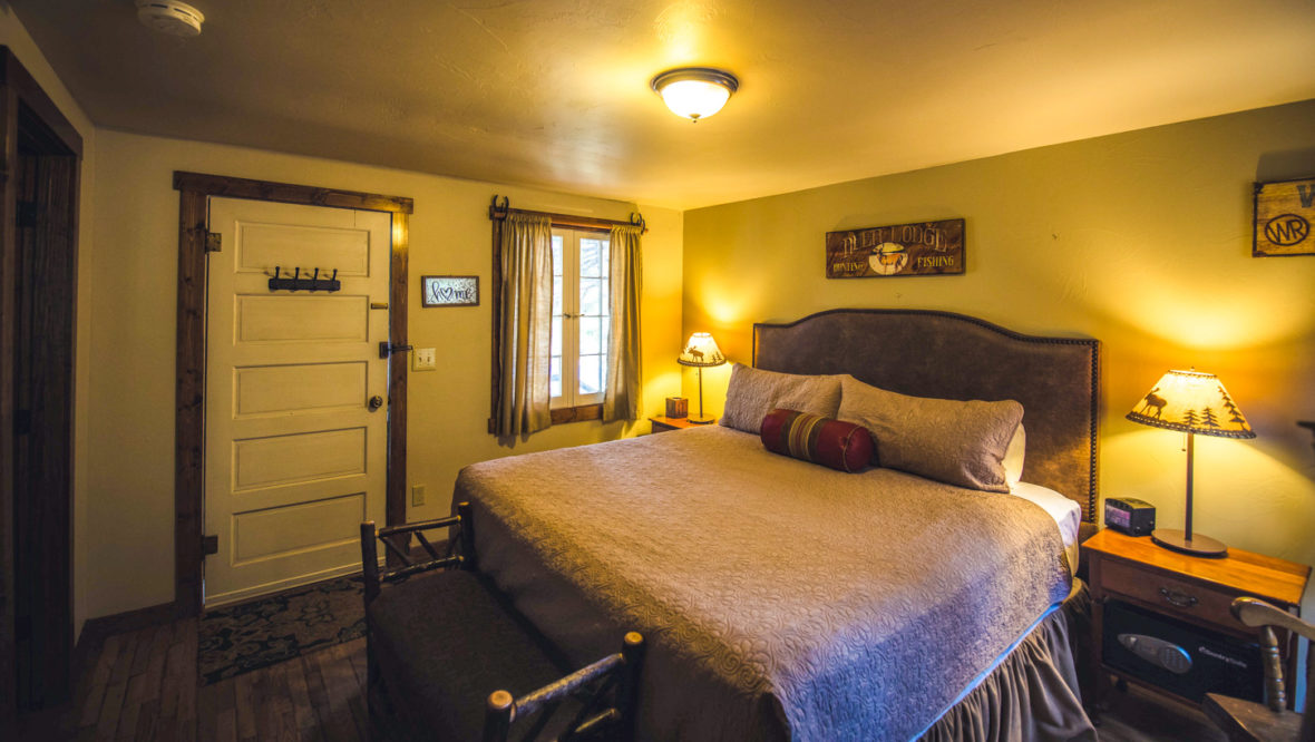 Long's peak cabin master bedroom with a king size bed.