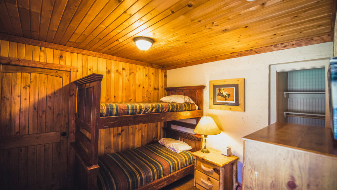 Meeker cabin second bedroom with a set of twin bunk beds.