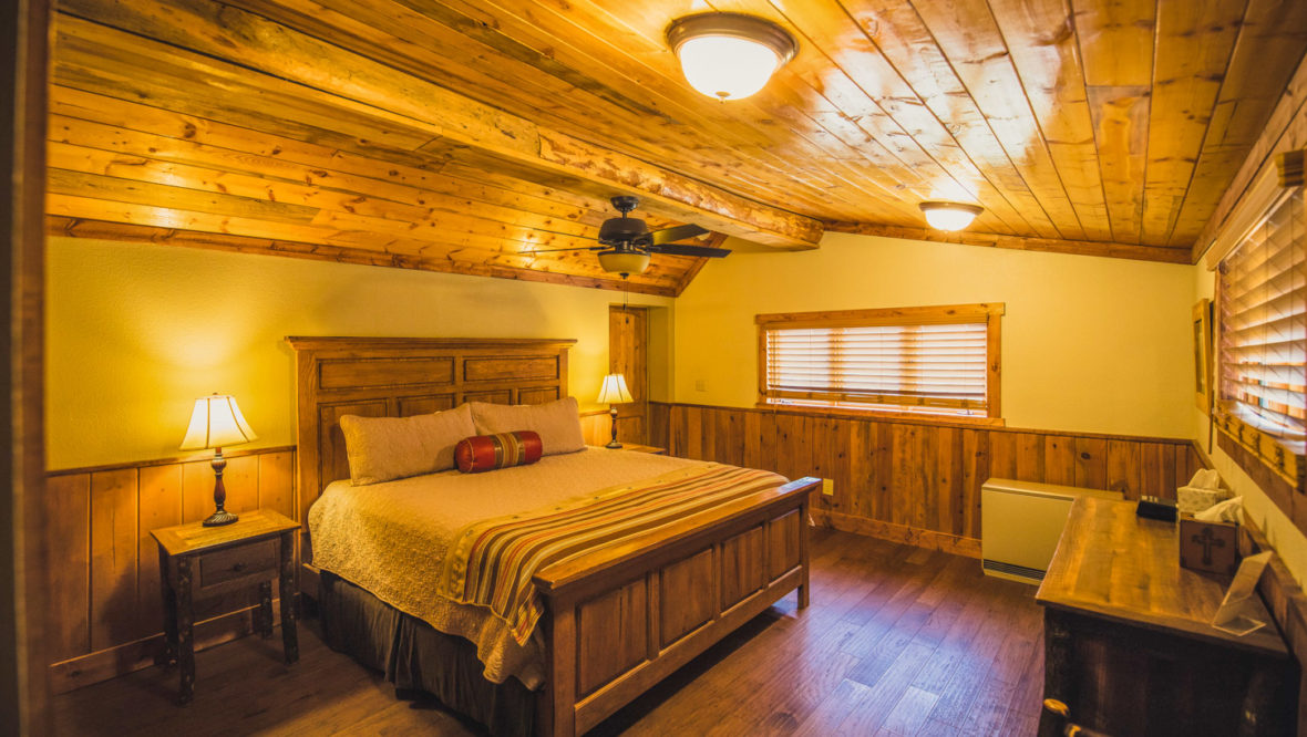 Meeker cabin master bedroom with king size bed.