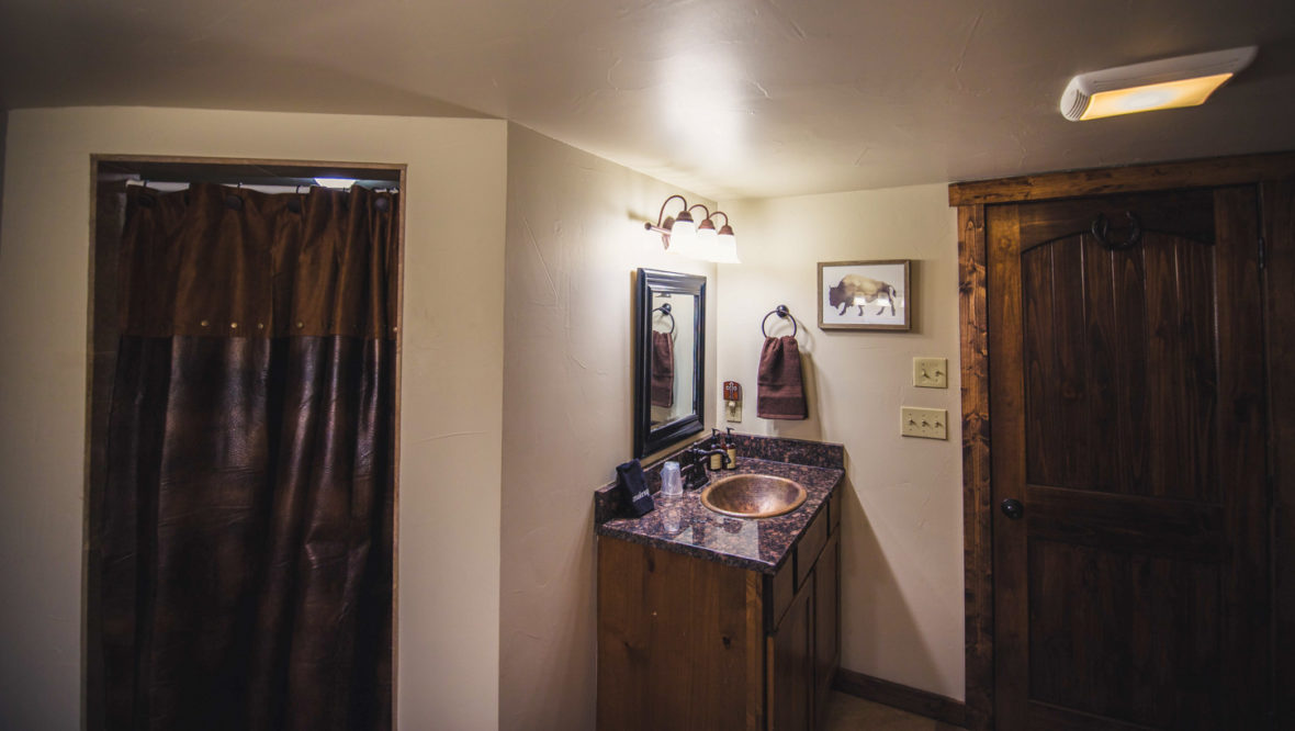 Twin sister cabin master bathroom with walk-in shower.